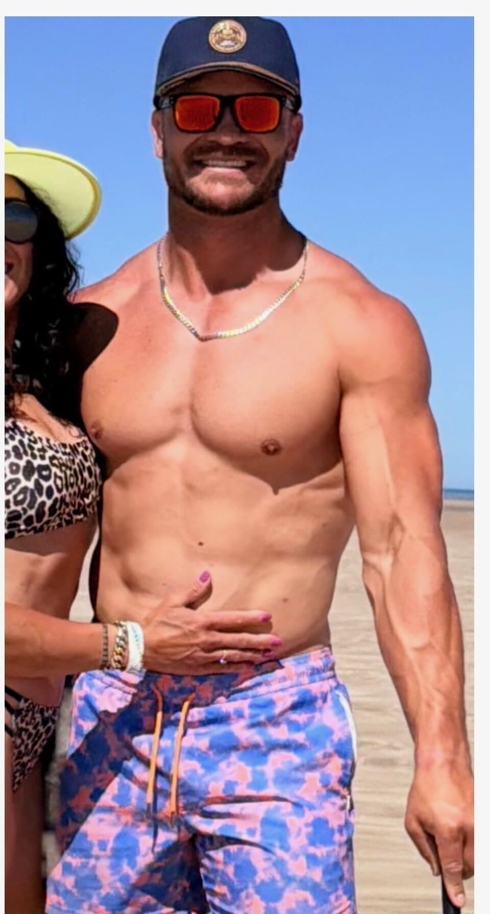 After: Cam Maddox, lean and muscular, standing on a beach