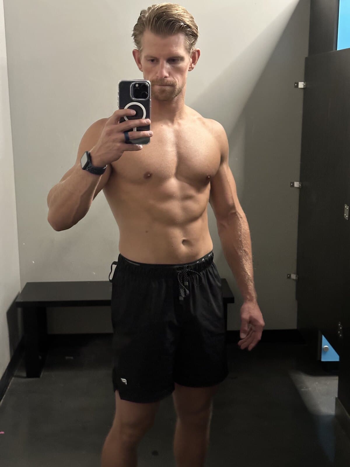 After: Ian, lean and muscular, in a mirror selfie